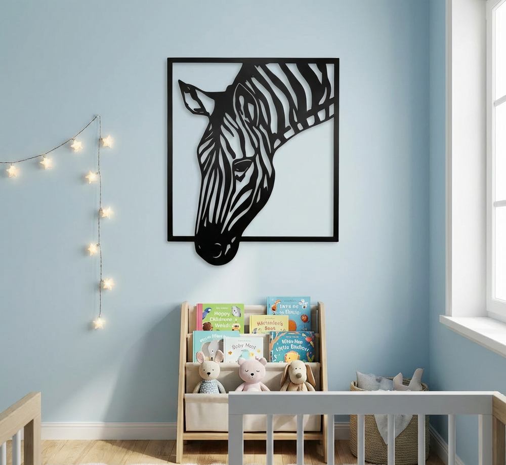 Modern matte black metal wall art featuring a zebra head silhouette extending outside a square frame set in a nursery or children's bedroom
