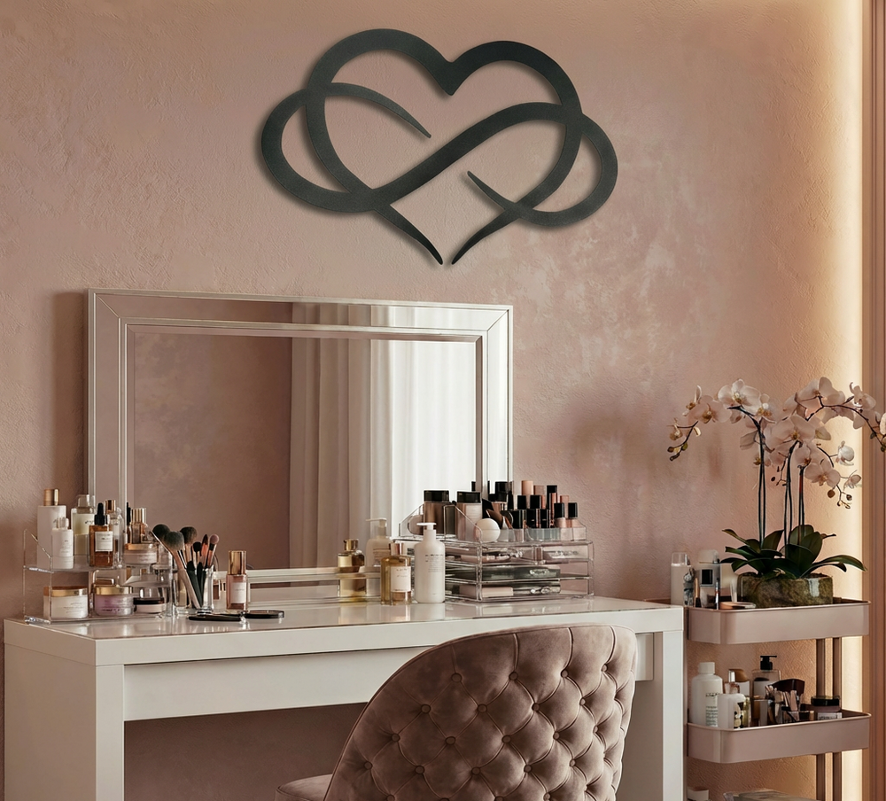 Matte black metal wall art featuring an intertwined heart and infinity symbol design hung above a mirror and
make up table in a bedroom