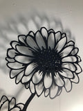 Metal wall decor of a Gerbera flower in a vase, showing great detail of the flower