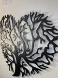 Metal wall decor of a tree of life cut into a heart shape
