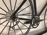 Metal bike wall art in a frame showing amazing detail of the chain and gears