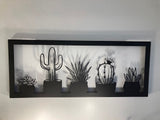 Metal wall decor showing five types of cacti in a frame, cut with great detail and gives a 3D effect on the wall behind, makes a great gift