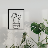 Metal wall art of a cacti in a frame, creates a fantastic 3D effect on the wall behind