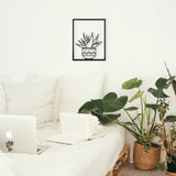 Metal wall art of a cacti in a frame, creates a fantastic 3D effect on the wall behind