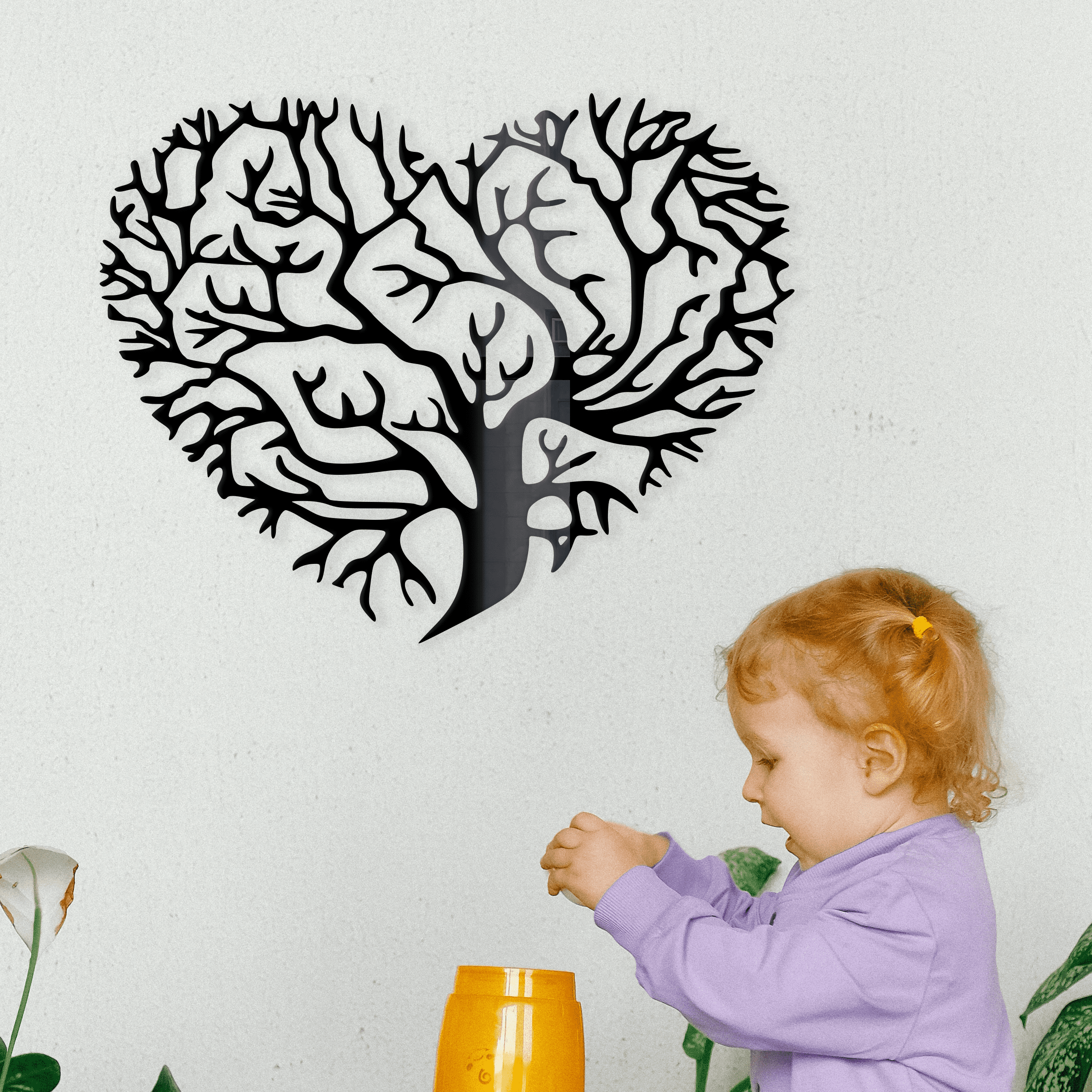 Metal wall decor of a tree of life cut into a heart shape